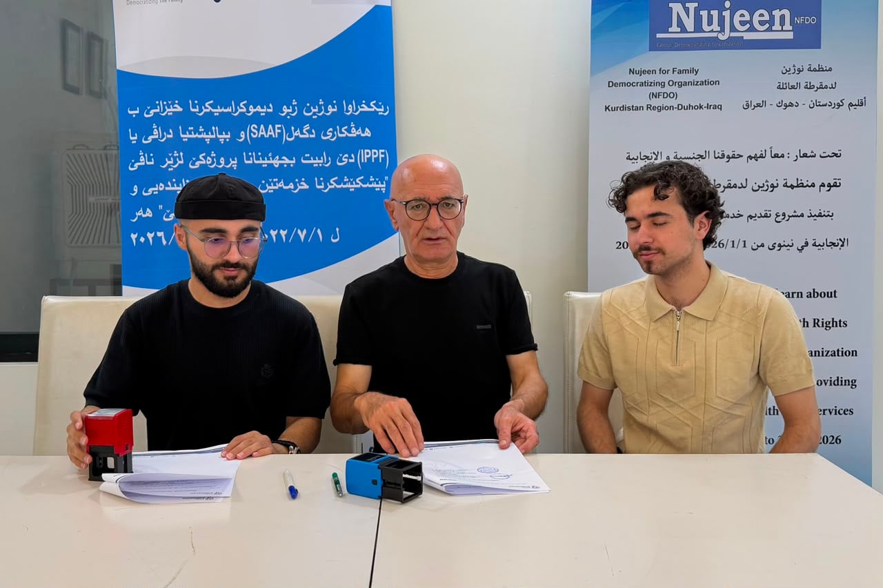 Nujeen leadership at a project signing event